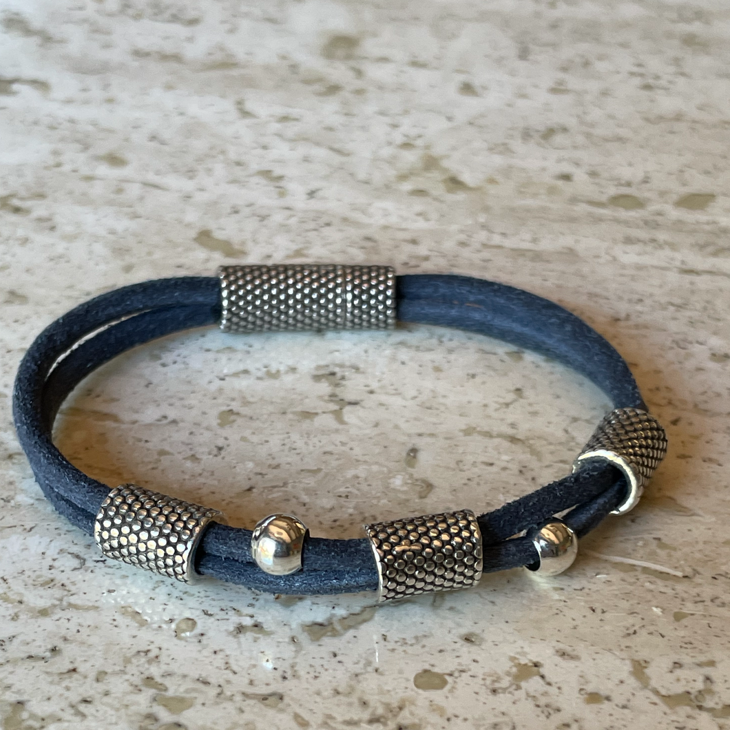 Woman's blue suede and silver plate bracelet