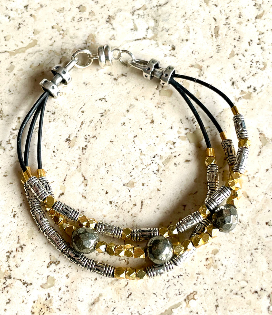 Woman's three-strand gold/silver  bracelet